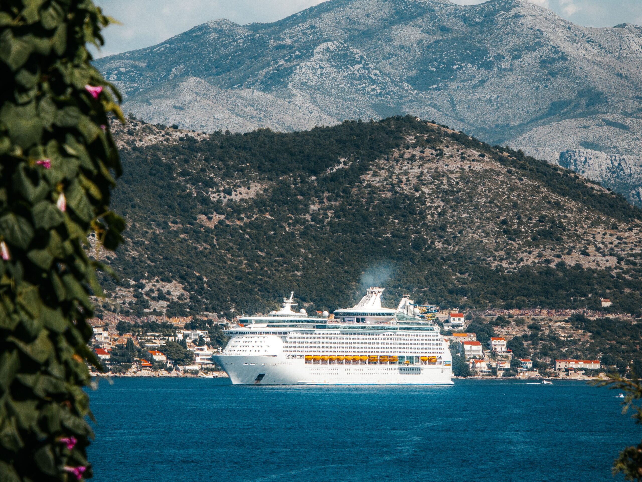 Cruise ship sailing along the Mediterranean coast